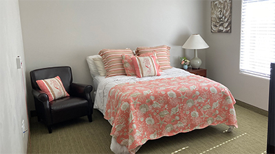 Private memory care community bedroom, comfortably decorated