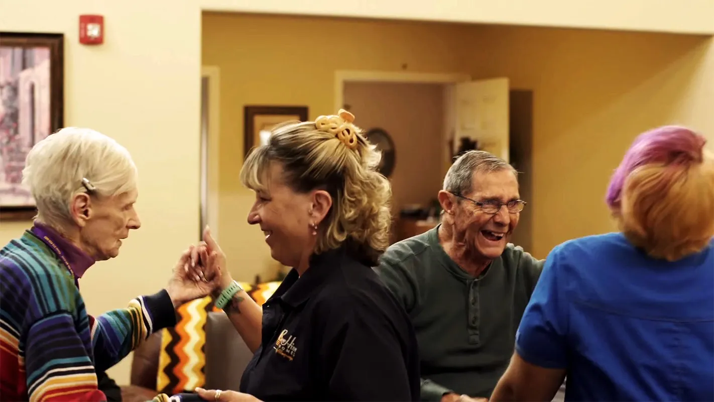 Residents and staff dancing