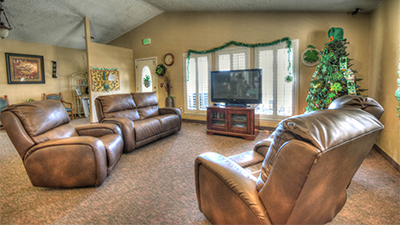 Relax in a comfortable armchair in our beautiful family room