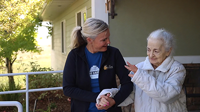 Caregiver compassionately assisting respite resident