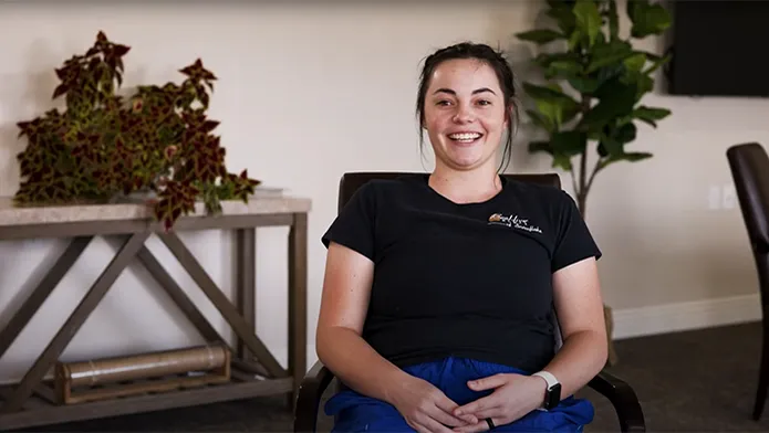 Caregiver sitting in beautiful living room talking