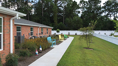 Backyard walkway of the BeeHive in Lynn Haven