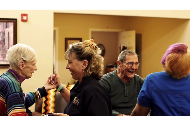 Residents and staff dancing
