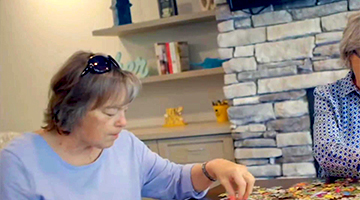 Senior woman building a puzzle