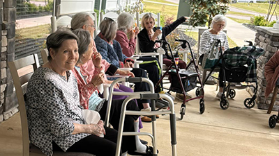 Seniors enjoying popsicles outside