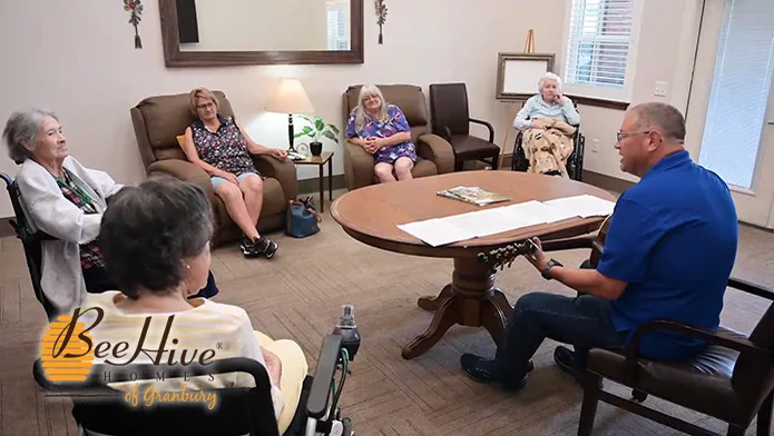Resident group listening to guitar music