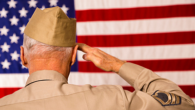 Veteran saluting the American Flag